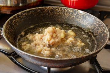 Goose fat in a frying pan