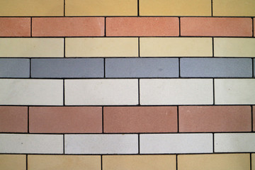 An image of a wall made from colorful bricks.