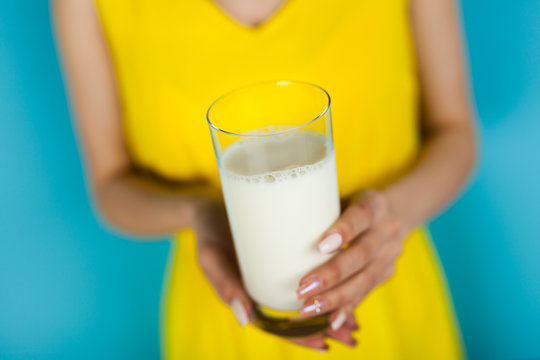 Woman holding a glass of milk