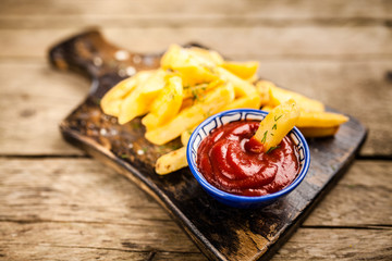 French fries on wooden table