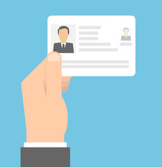 Hand holding identity card