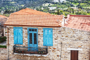Typical stone house with a tiled roof in a Cypriot village