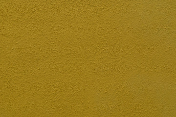 Fototapeta premium dark yellow cement wall with fine structure - detail