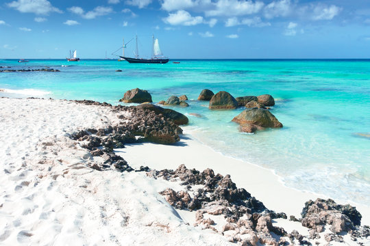 Arashi Beach Aruba Caribbean Sea sand rocks crystal clear turquoise water boats