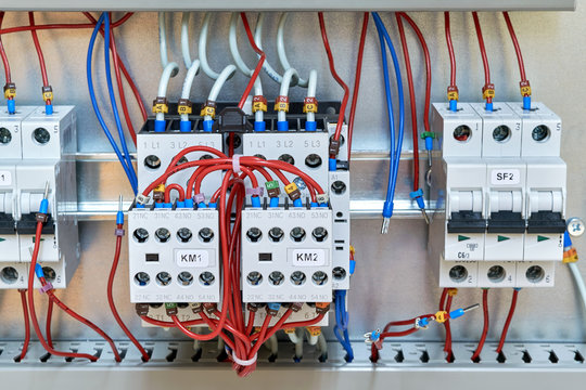 Magnetic starters with front additional contacts and modular circuit breakers in electrical Cabinet. Wires or cables with lugs for connection of additional electrical equipment have been removed.
