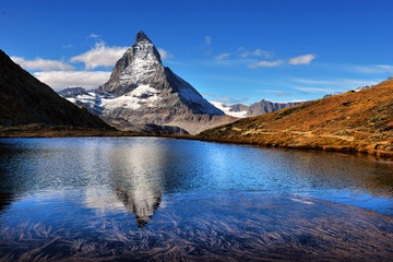 Fototapeta na wymiar Mt Matterhorn reflected in Riffelsee Lake Zermatt Canton of Valais