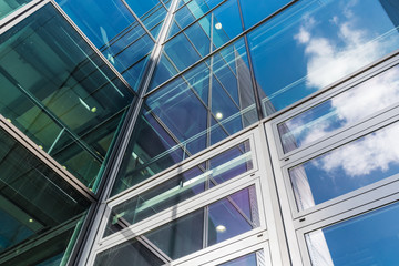 Obraz premium The glass architecture in city against a sky
