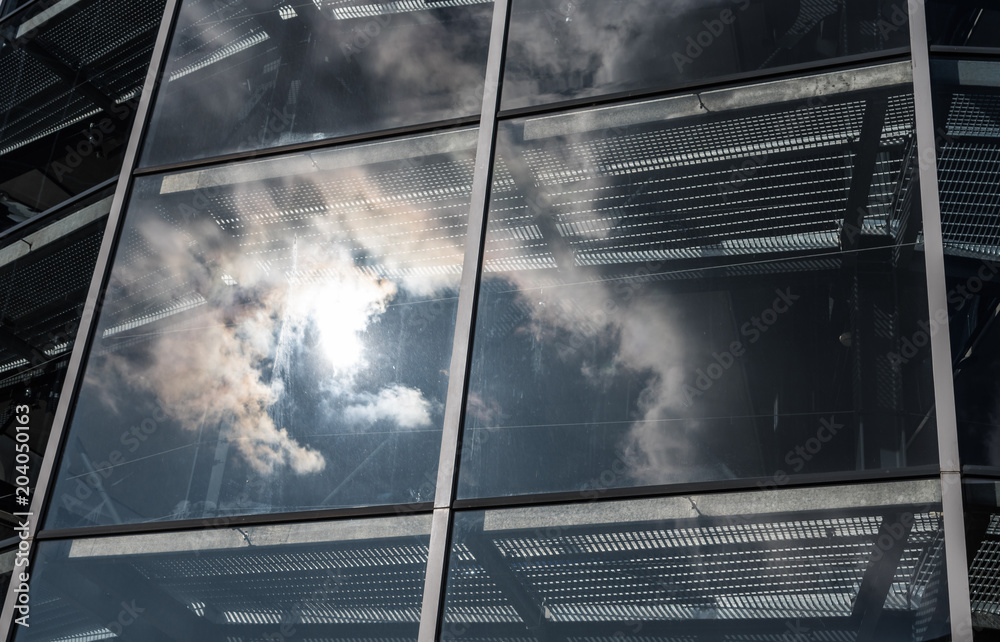 Poster The glass architecture in city against a sky