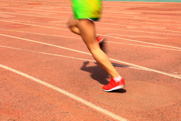 Athletes running in the playground of the runway