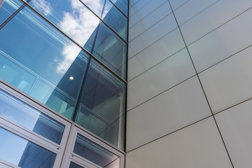 Fototapeta na wymiar The glass architecture in city against a sky