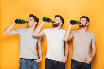 Three young men drinking beer