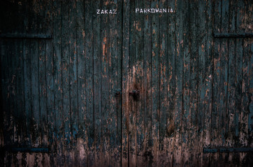 Old wooden gate with faded paint