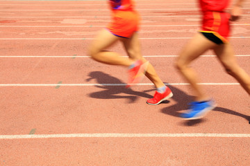 Athletes running in the playground of the runway