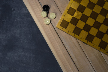 Sports or recreation Board game board with checkers. Hobby. Checkers on the playing field for the...