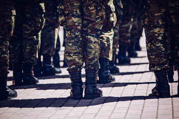 Soldiers in masking camouflage uniforms on parade