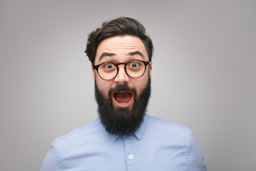 Shocked bearded man in glasses