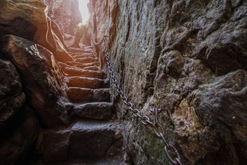 Rock stairs on footpath to Szczeliniec Wielki mountain - obrazy, fototapety, plakaty