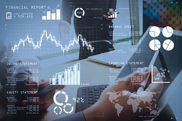 two colleague web designer discussing data and digital tablet docking keyboard and computer laptop with smart phone and design diagram on marble desk,sun light effect