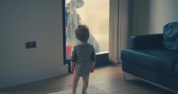 Little boy looking at window cleaner