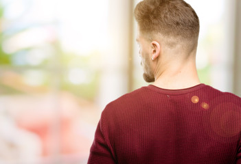 Handsome young man backside, rear view