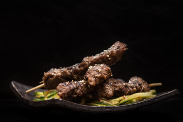 Pork skewers and zucchini