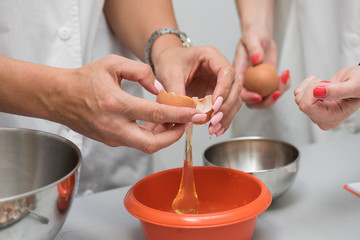 Separating the egg white from the yolk