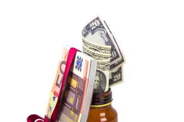 Obraz na płótnie Canvas Money Banknotes inside Medicine Pills Bottle