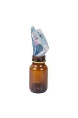 Money Banknotes inside Medicine Pills Bottle