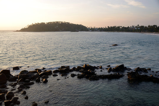 Tropical beach in the town of Mirissa at sunset, Sri Lanka
