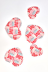 Paper hearts with text love, top view. White background with decorative paper hearts.