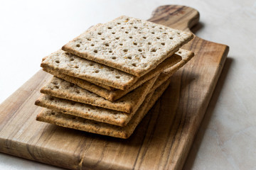 Stack of Honey Flavored Graham Crackers on Wooden Surface.