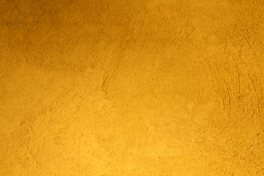 Yellow plaster wall texture.