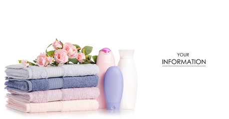 Obraz na płótnie Canvas A stack set towels plastic bottle with cosmetic cream lotion gel for body flower pattern