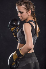 Sports girl in boxing gloves