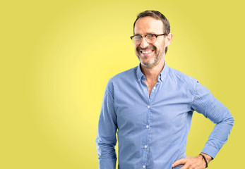 Fototapeta premium Handsome middle age man confident and happy with a big natural smile laughing