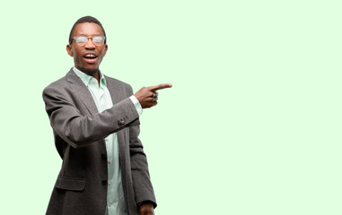 African black man wearing jacket pointing away side with finger