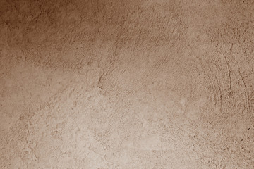 Plaster wall texture in brown color.