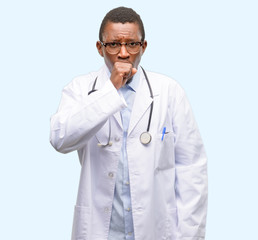 Young black doctor, medical professional sick and coughing, suffering asthma or bronchitis, medicine concept