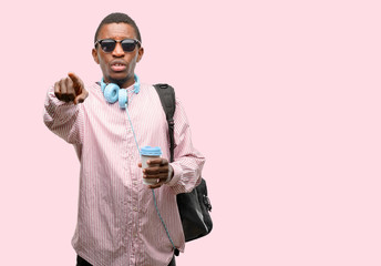 African black man student pointing to the front with finger