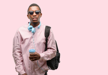 African black man student with sleepy expression, being overworked and tired