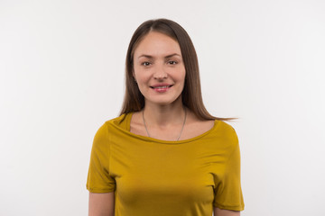 Fototapeta premium Pretty woman. Pleasant beautiful woman looking at you while standing against white background