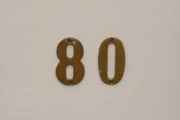 House number 80  sign on door