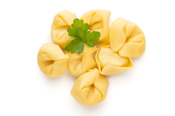Raw homemade pasta,tortellini with herbs.
