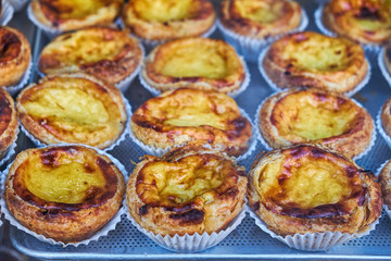 Egg tart, traditional Portuguese dessert, pastel de nata on a tray