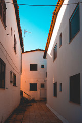 Fototapeta na wymiar some white houses with a small street
