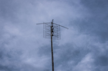 Old antenna on the sky background