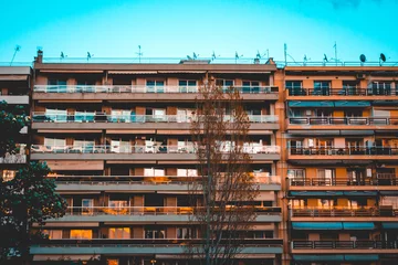 Fototapeten orange apartment complex in the afternoon light © Robert Herhold