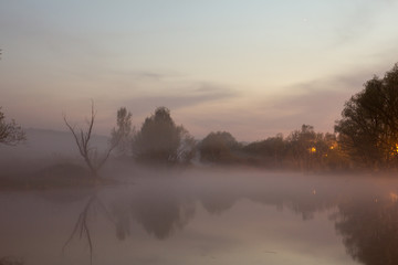 Foggy sunset on the lake