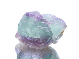 macro shooting of natural mineral rock specimen -  fluorite stone on an isolated white background,reflection - obrazy, fototapety, plakaty