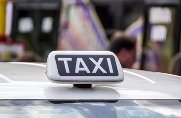 close up off written taxi on the car